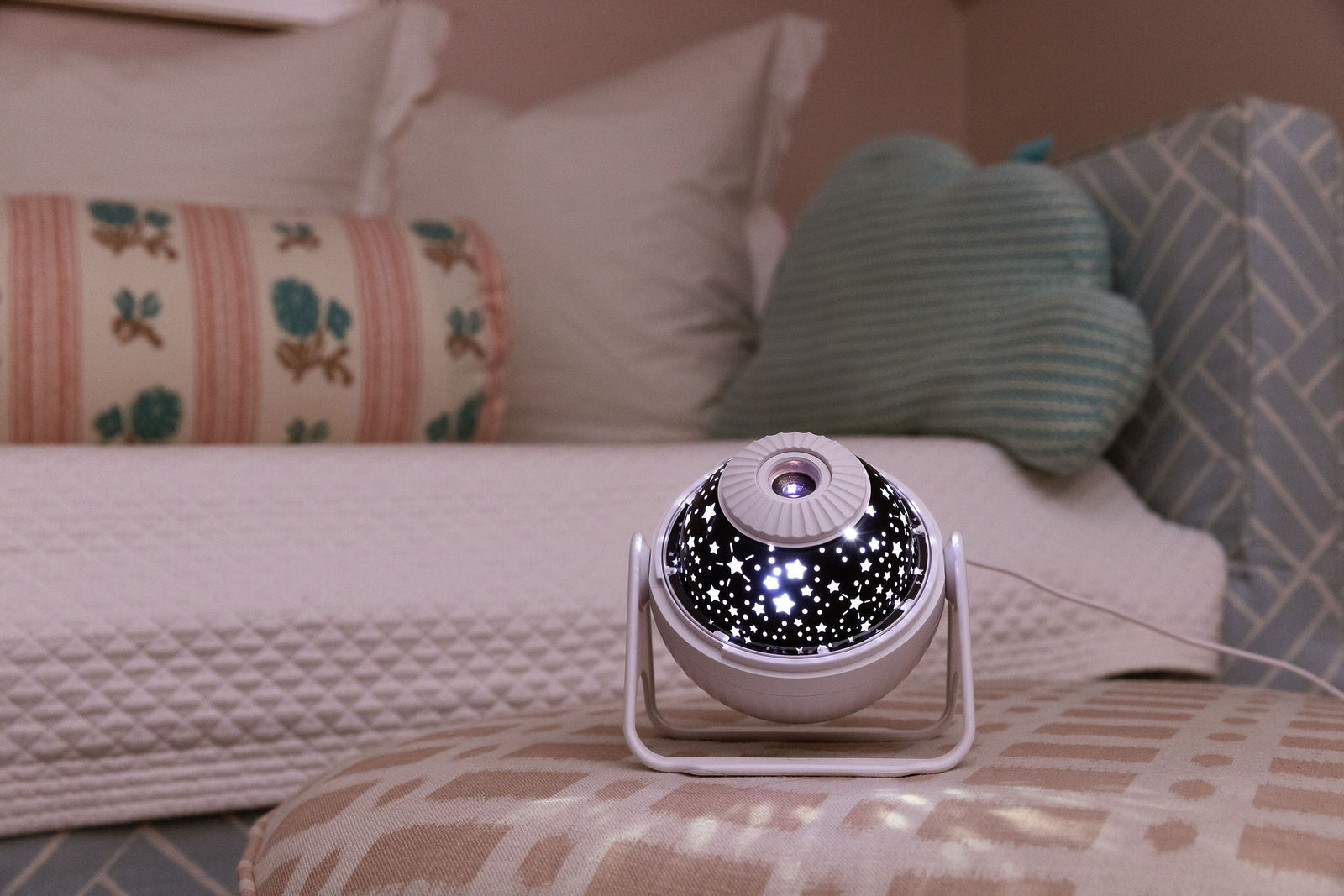 Projector on ottoman with lights on