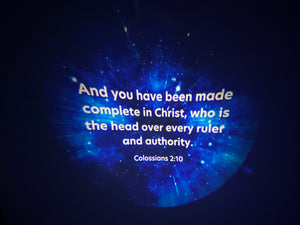 Image of disc Colossians 2:10. text includes: And you have been made complete in Christ, who is the head over every ruler and authority.  Image is a star night galaxy. 