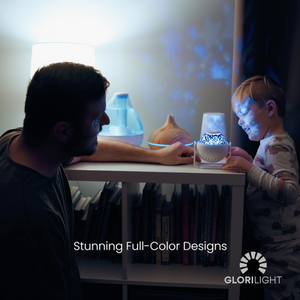 Picture of a father and a son looking at and touching GloriLight on a kids book shelve. Mid bottom center text reads, stunning full-color designs. GloriLight logo and name in bottom right corner in white.