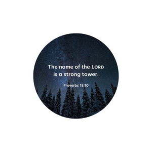 Circular niightime picture of a starry sky in view from towering pine trees below.  Text reads in white lettering The name of the Lord is a strong tower Proverbs  18:10.