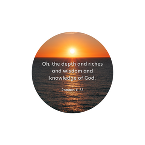 Circular picture of an ocean sunset over the horizon overlaid with white text. It reads Oh the depths and riches and wisdom and knowledge of God Romans  11:33.