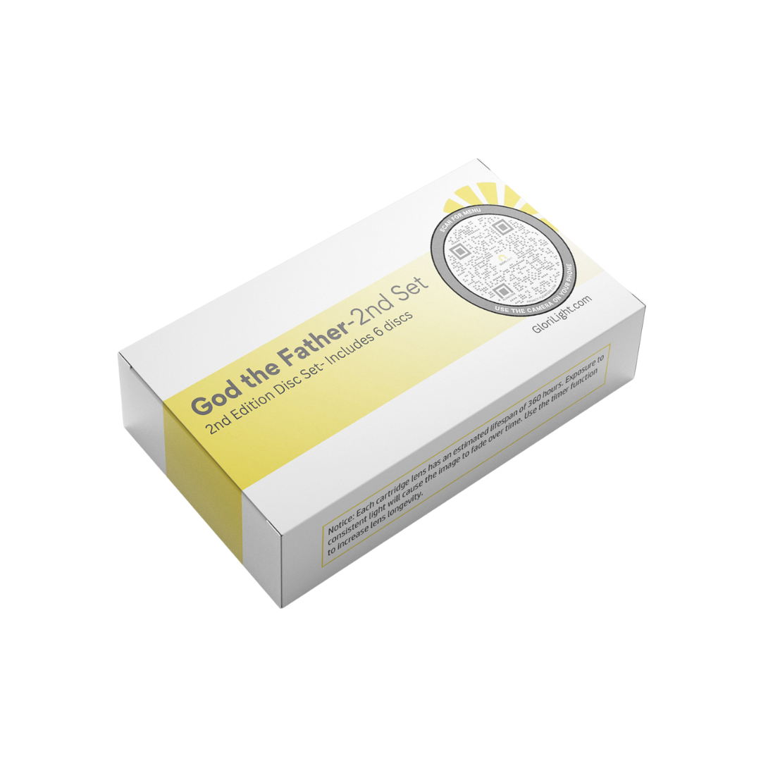 Picture of the box of the second set of discs. On top of the box text reads, God the Father, second set, second edition disc set, includes six discs. The top of box also has a QR code on the right. Behind the text is a golden rectangle that extends to the left side of box. Behind QR code on right is the yellow beams of the GloriLight logo. On the bottom of the box there is unreadable text due to it being so small. There is an all white background behind picture box.